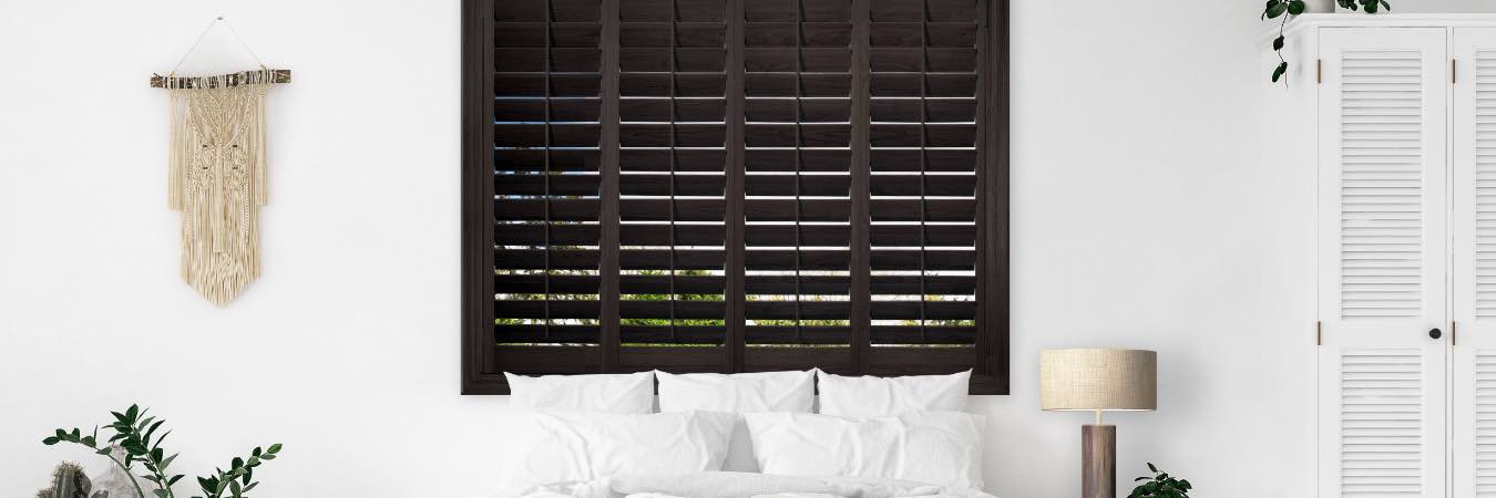 Wood shutters in bedroom in 